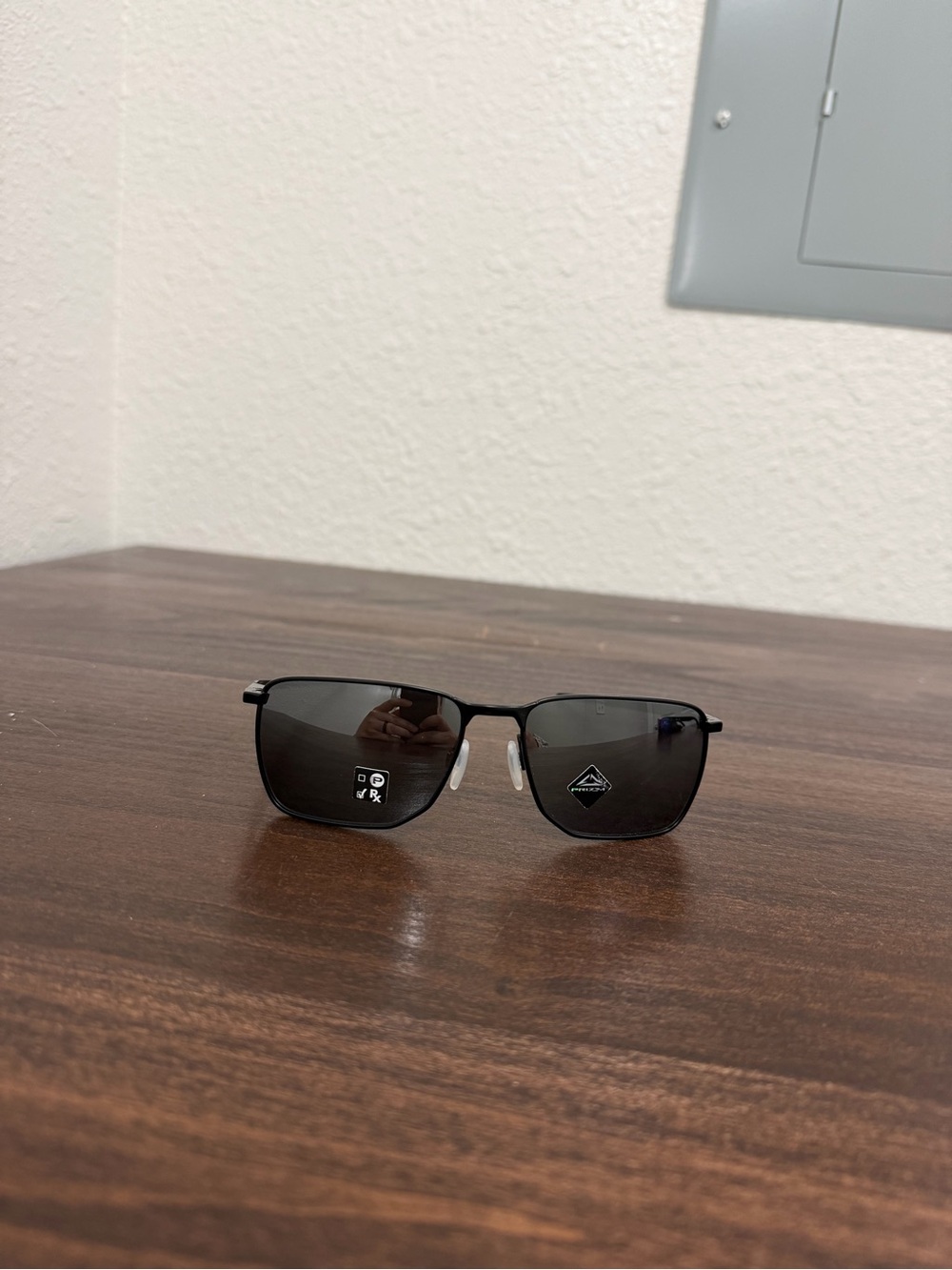 Black Oakley Metal Frame Sunglasses with Dark Lenses